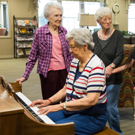 Residents enjoying piano music
