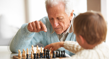 Nursing home residents playing chess